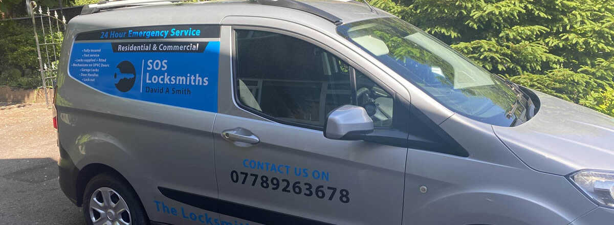 SOS Locksmiths van showing the 24 hour emergency service and phone number